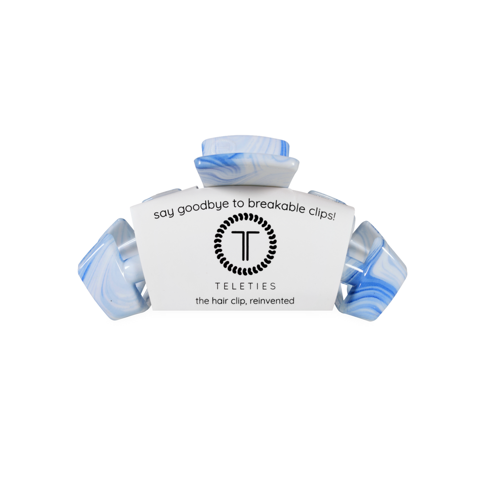 TELETIES blue and white marbled small claw clip with flexible teeth for a secure hold.
