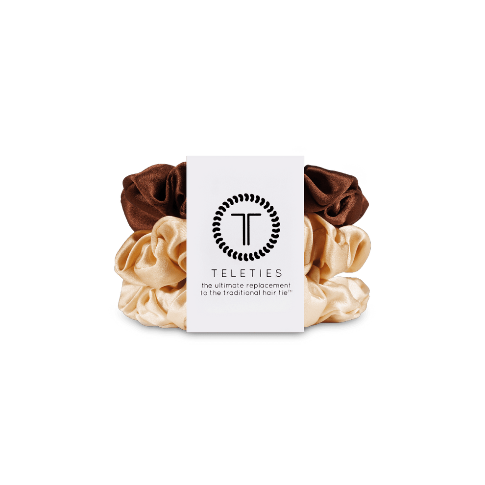 TELETIES small 100% silk scrunchies in neutral tones, sold in packs of three, featuring non-slip technology and gentle hair hold. Prevents breakage and creases with increased comfort.
