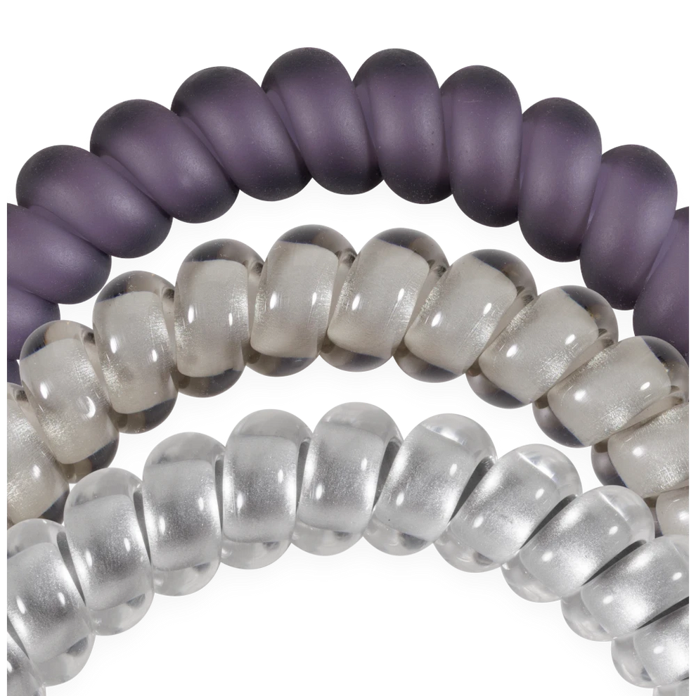 TELETIES Good Hair Rx small spiral hair ties in purple and clear shades, designed for a secure, no-rip hold.

