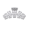 TELETIES medium claw clip in white with a black polka dot pattern, featuring a curved design for secure hair styling.
