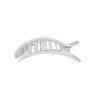TELETIES white flat round hair clip with black polka dots, designed for comfortable wear while leaning back.
