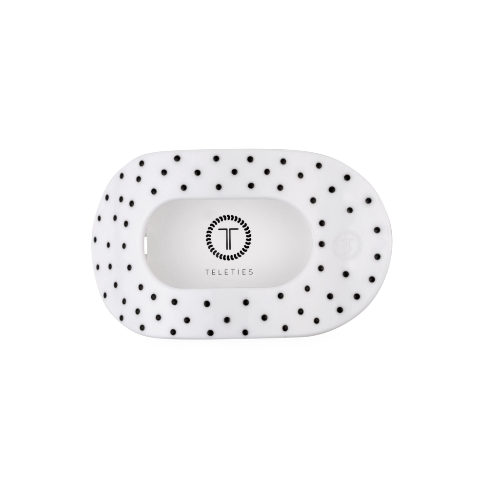 TELETIES medium flat round hair clip in white with a black polka dot pattern and central logo detail
