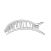 TELETIES large white flat hair clip with black polka dots, designed for comfortable wear against headrests.
