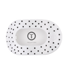 TELETIES large flat round hair clip in white with black polka dots, designed for comfortable wear against headrests.
