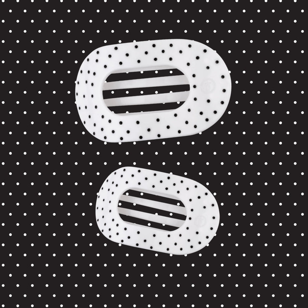 TELETIES white flat round hair clips with black polka dots, designed for comfortable wear against headrests.
